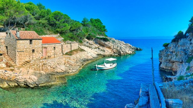Bay with old stone houses and fishing boat, Lastovo island, Croatia - Croatian waters SimpleSail sailing routes